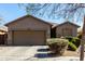 Charming single-story home with a two-car garage and well-manicured front yard at 273 S 152Nd Ave, Goodyear, AZ 85338