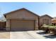 Single-story home with attached garage and a well-maintained front yard at 273 S 152Nd Ave, Goodyear, AZ 85338