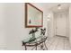 Inviting hallway featuring tiled floors, arched doorways, and a dolphin statue at 273 S 152Nd Ave, Goodyear, AZ 85338