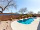 Outdoor pool featuring desert landscaping and spacious patio, creating a private backyard oasis perfect for relaxation and recreation at 273 S 152Nd Ave, Goodyear, AZ 85338