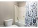 Cozy bathroom featuring a tub with a shower head and a decorative floral shower curtain at 2821 S Skyline Dr # 107, Mesa, AZ 85212