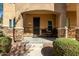 Inviting covered front porch with stone accents and seating area at 2821 S Skyline Dr # 107, Mesa, AZ 85212