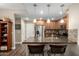 Well-equipped kitchen featuring breakfast bar and access to an adjacent room at 2821 S Skyline Dr # 107, Mesa, AZ 85212