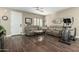 Comfortable living room with wood flooring, neutral paint, and ample seating at 2821 S Skyline Dr # 107, Mesa, AZ 85212