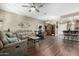 Bright living area featuring hard wood floors and an open layout to the kitchen at 2821 S Skyline Dr # 107, Mesa, AZ 85212