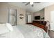 A gorgeous main bedroom featuring hardwood floors, a ceiling fan and ensuite bathroom with glass shower doors at 2821 S Skyline Dr # 107, Mesa, AZ 85212