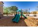 Community playground area with a green slide, play structures, benches and shade trees at 2821 S Skyline Dr # 107, Mesa, AZ 85212