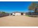 Expansive backyard with sand, patio furniture, trampoline and small playset at 3009 N 81St Ln, Phoenix, AZ 85033