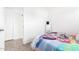 Cozy bedroom featuring twin bed, natural light and tile flooring at 3009 N 81St Ln, Phoenix, AZ 85033