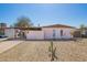 Charming single-story home with a covered carport and low-maintenance desert landscaping at 3009 N 81St Ln, Phoenix, AZ 85033