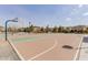 Outdoor community basketball court ready for play with well-maintained surface and hoops amidst neighborhood homes at 3816 E Rakestraw Ln, Gilbert, AZ 85298