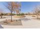 Picturesque community park with walking paths, landscaped areas, seating, and a covered pavilion for gatherings at 3816 E Rakestraw Ln, Gilbert, AZ 85298