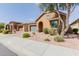 Charming home with well maintained landscaping and inviting curb appeal on a sunny day at 3816 E Rakestraw Ln, Gilbert, AZ 85298