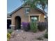 Inviting single-story home with brick and stone accents and desert landscaping at 3816 E Rakestraw Ln, Gilbert, AZ 85298