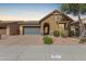 Charming single-story home featuring an attached garage and desert-style landscaping at 3816 E Rakestraw Ln, Gilbert, AZ 85298