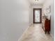 Inviting foyer with a beautiful decorative front door and ceramic tile flooring at 3816 E Rakestraw Ln, Gilbert, AZ 85298