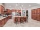 Modern kitchen with island seating, stainless appliances and beautiful granite countertops at 3816 E Rakestraw Ln, Gilbert, AZ 85298