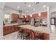 Gourmet kitchen with granite countertops, stainless steel appliances, and a large island at 3816 E Rakestraw Ln, Gilbert, AZ 85298