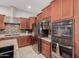 Updated kitchen with stainless steel appliances, granite counters, and modern cabinetry at 3816 E Rakestraw Ln, Gilbert, AZ 85298