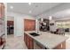 Open concept kitchen with stainless steel appliances and views to the Gathering room at 3816 E Rakestraw Ln, Gilbert, AZ 85298