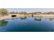 Picturesque lake view featuring a charming bridge and community gathering spaces, enhancing the neighborhood's appeal at 3816 E Rakestraw Ln, Gilbert, AZ 85298