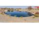 Scenic lake view with meticulously landscaped shoreline, offering a serene and attractive community space at 3816 E Rakestraw Ln, Gilbert, AZ 85298