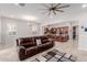 Open-concept living room with tile floors and a view into the gourmet kitchen at 3816 E Rakestraw Ln, Gilbert, AZ 85298