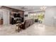 Spacious living room featuring a decorative wood wall, stylish furniture, and a ceiling fan at 3816 E Rakestraw Ln, Gilbert, AZ 85298