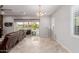 Bright living room featuring a sliding glass door to the backyard with a pool at 3816 E Rakestraw Ln, Gilbert, AZ 85298