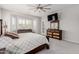 Open main bedroom with sitting area, updated dresser, and access to outdoor living at 3816 E Rakestraw Ln, Gilbert, AZ 85298