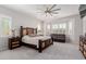 Spacious main bedroom with a seating area, ceiling fan and shuttered windows at 3816 E Rakestraw Ln, Gilbert, AZ 85298