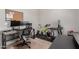 Bright office space with adjustable desks, ergonomic chair, and gym equipment at 3816 E Rakestraw Ln, Gilbert, AZ 85298