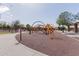 Colorful playground equipment in a park setting, perfect for Gathering fun and recreation at 3816 E Rakestraw Ln, Gilbert, AZ 85298
