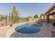 Inviting backyard pool with stone tile and gravel landscaping for a modern look at 3816 E Rakestraw Ln, Gilbert, AZ 85298