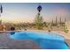Beautiful backyard pool featuring a serene water view and desert landscaping at 3816 E Rakestraw Ln, Gilbert, AZ 85298
