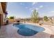 Private backyard pool area with desert landscape and fencing, perfect for summer enjoyment at 3816 E Rakestraw Ln, Gilbert, AZ 85298