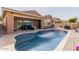 Beautiful backyard pool with attached covered patio, ideal for entertaining guests at 3816 E Rakestraw Ln, Gilbert, AZ 85298