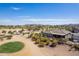 Beautiful aerial of desert community and surrounding golf course showcasing mountain views in the distance at 3948 E Vallejo Dr, Gilbert, AZ 85298