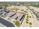 Aerial view of a desert home showcasing desert landscaping, a lawn, and a golf course at 3948 E Vallejo Dr, Gilbert, AZ 85298
