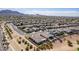 High-angle aerial view showing desert homes with swimming pools and mountain views against a blue sky at 3948 E Vallejo Dr, Gilbert, AZ 85298