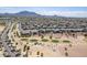 Aerial view of the community including a golf course and mountain views in the background at 3948 E Vallejo Dr, Gilbert, AZ 85298