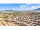 Scenic aerial view of a community near a golf course with mountain views in the background at 3948 E Vallejo Dr, Gilbert, AZ 85298