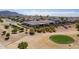 Backyard view featuring a manicured lawn, desert landscaping and nearby golf course at 3948 E Vallejo Dr, Gilbert, AZ 85298
