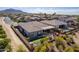 Aerial view showcasing an outdoor living space with patio, small lawn and desert landscape at 3948 E Vallejo Dr, Gilbert, AZ 85298