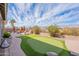 Well-maintained backyard features a putting green and offers an inviting outdoor retreat at 3948 E Vallejo Dr, Gilbert, AZ 85298