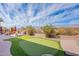 Private backyard with an artificial putting green and a neatly landscaped space, perfect for relaxation at 3948 E Vallejo Dr, Gilbert, AZ 85298