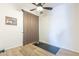 Bright bedroom with hardwood floors, large curtain and natural lighting, ideal for a versatile space at 3948 E Vallejo Dr, Gilbert, AZ 85298