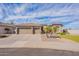 This well-maintained single-story property features a three-car garage and drought tolerant landscaping at 3948 E Vallejo Dr, Gilbert, AZ 85298