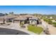Charming desert home with meticulous landscaping, boasting a beautiful curb appeal and a gated front yard at 3948 E Vallejo Dr, Gilbert, AZ 85298