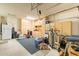 Spacious garage with built-in storage cabinets, laundry sink, and overhead lighting at 3948 E Vallejo Dr, Gilbert, AZ 85298